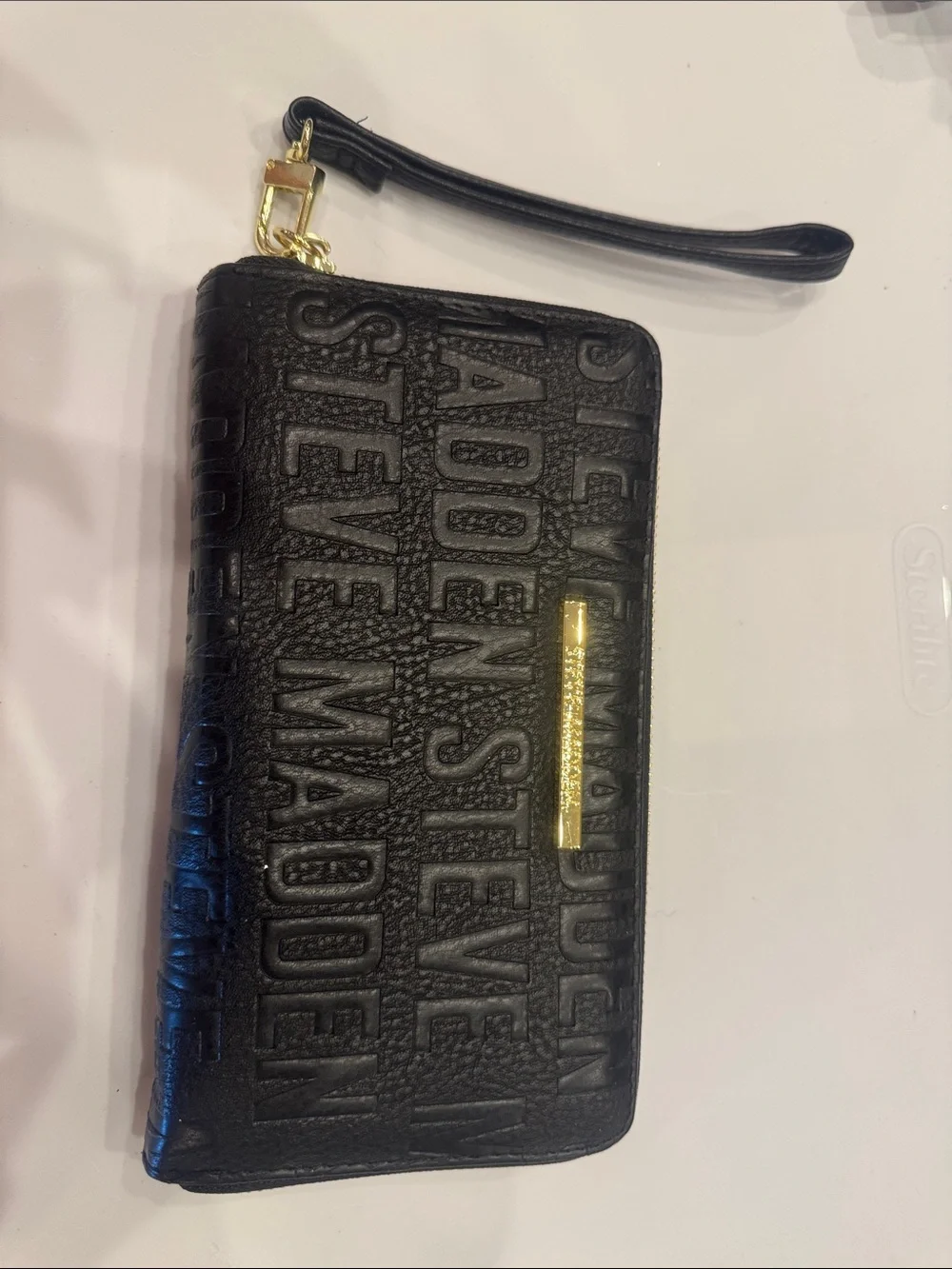 Steve Madden Black Embossed Wristlet with Gold Accent